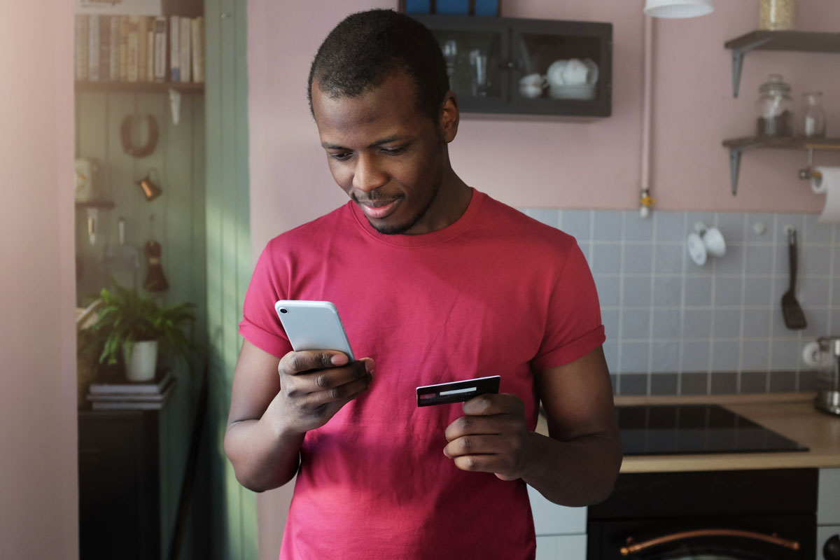 man deciding between taking a loan vs a credit card
